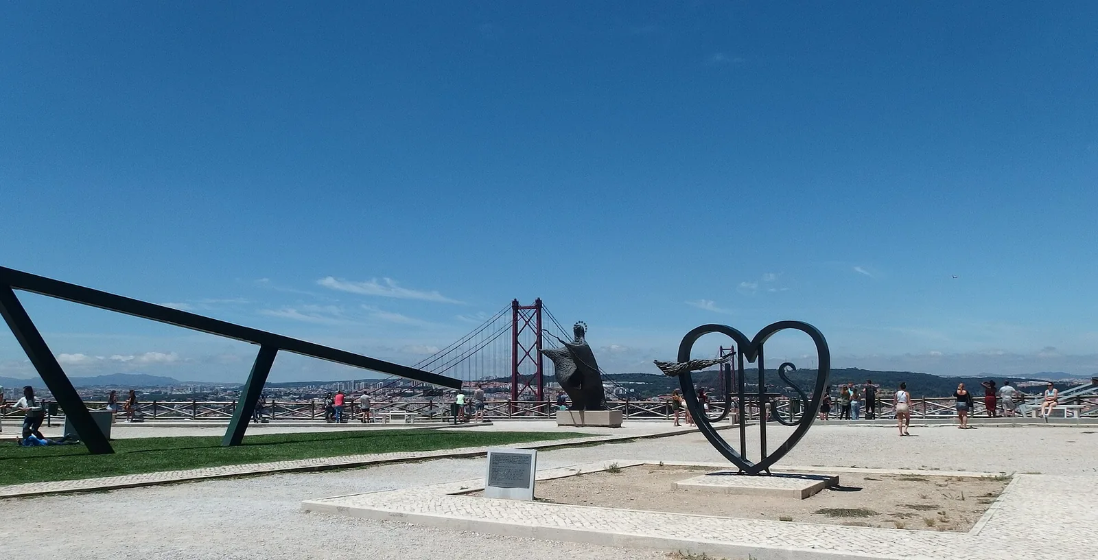 The viewpoint terrace at the Cristo Rei sanctuary in Almada, with the 25 de Abril bridge and Lisbon across the river