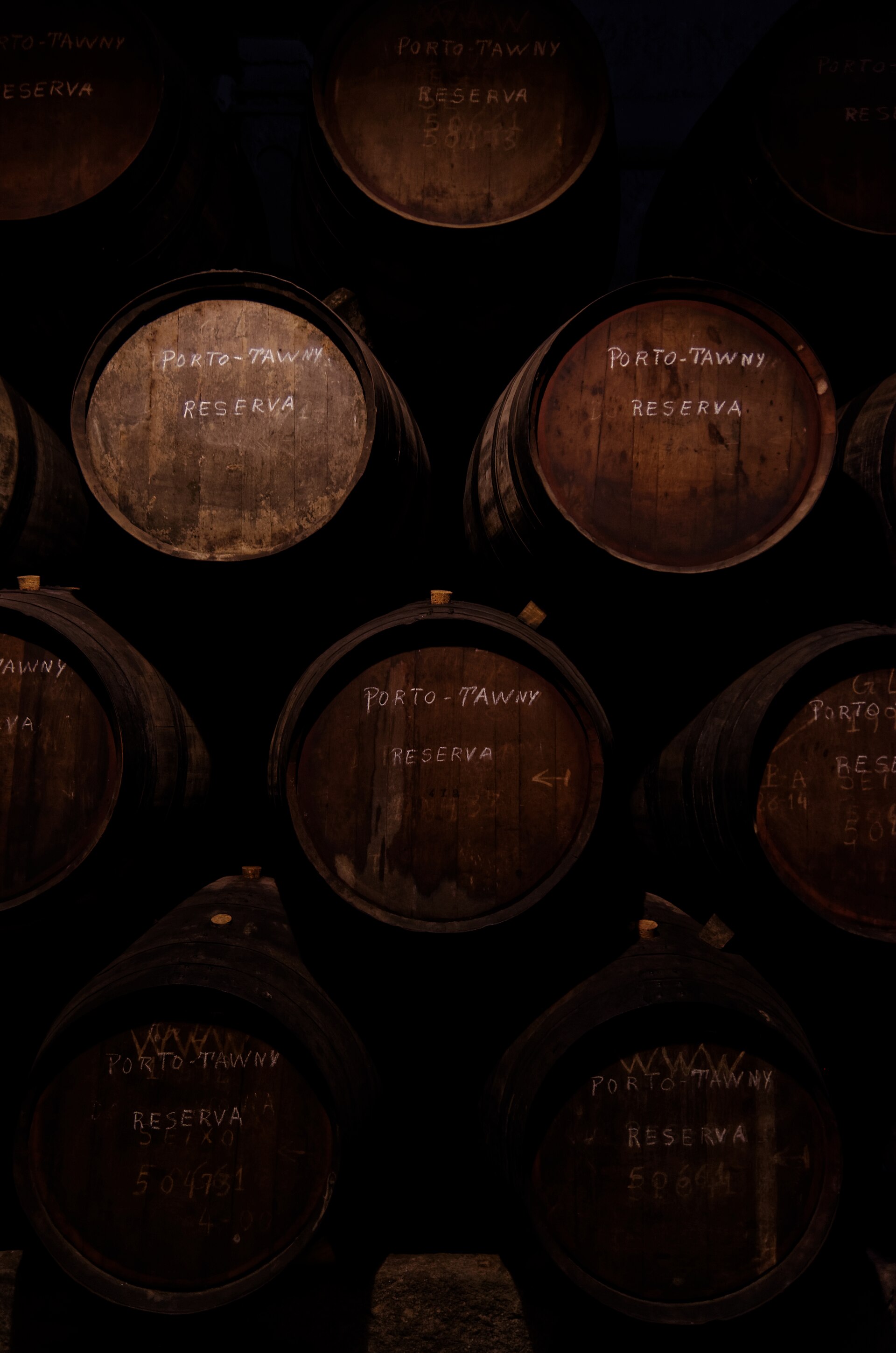 Port wine barrels ageing in a Vila Nova de Gaia cellar, Porto.