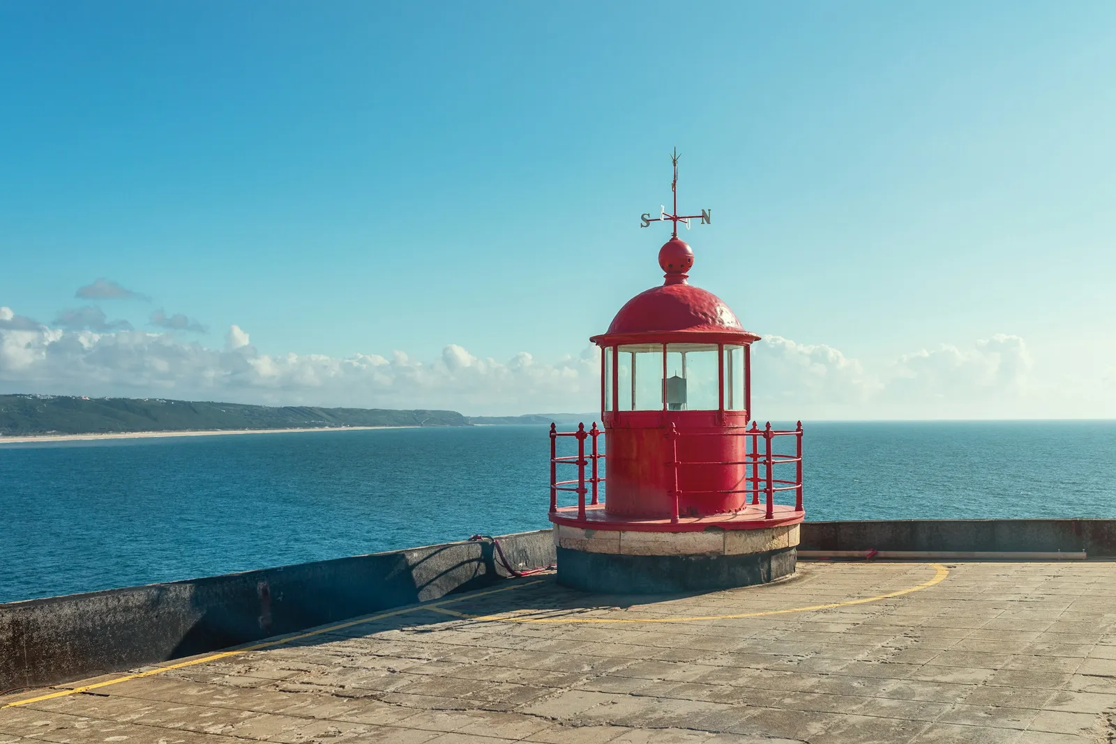 The red lighthouse of Nazaré at the Sítio fort above the North Beach