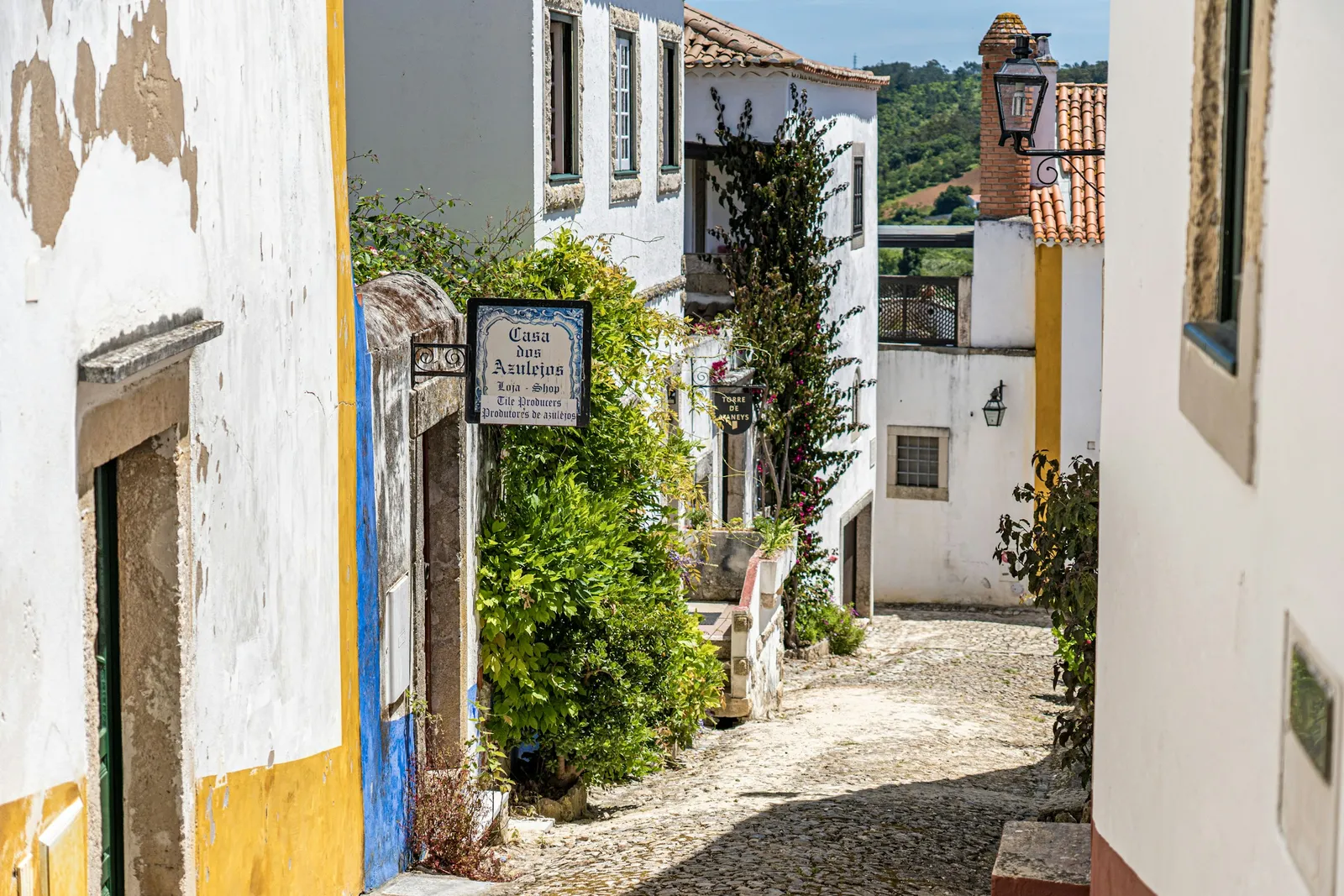 A whitewashed street inside the walls of Óbidos