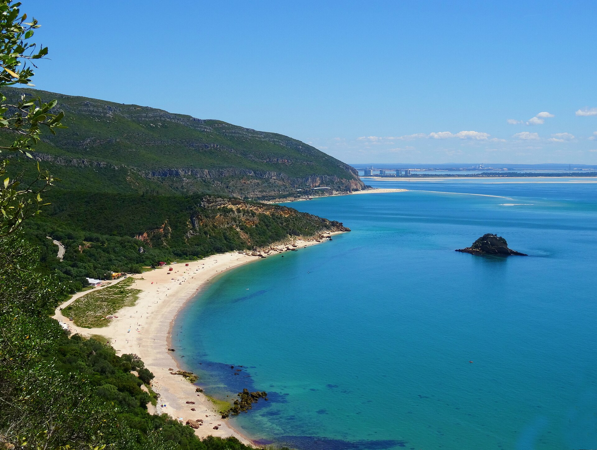 The Serra da Arrábida ridge above the turquoise bay and beach at Portinho da Arrábida